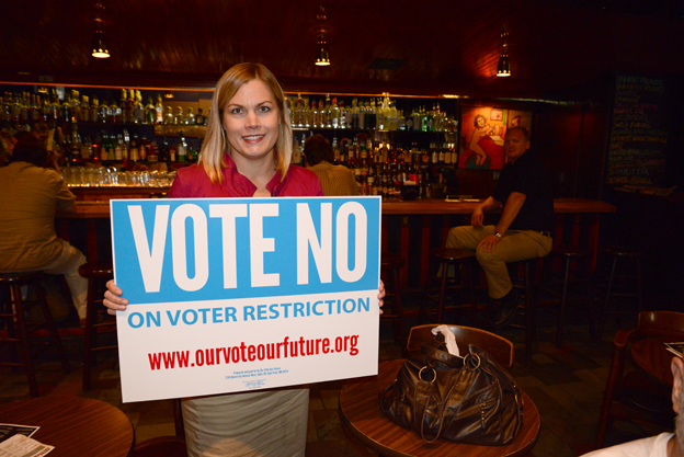 Greta Bergstrom with Vote No sign