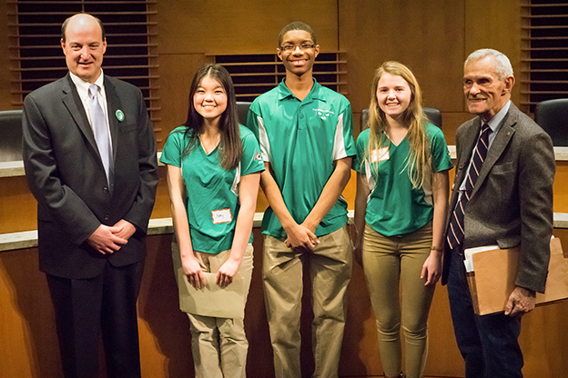 Rep. Paul Rosenthal, Rep. Ron Erhardt and members of the Edina High School robotics team, "The Green Machine" | Photo by the author