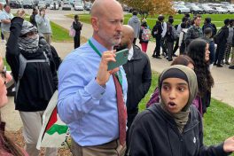 School administrator looms over small protester